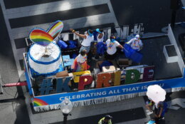 Parade-goers participate in the annual Capital Pride Parade in Washington, DC, on June 20, 2026.  (Photo by Ken Cedeno / AFP via Getty Images)