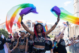 WASHINGTON, DC - JUNE 20: People march in the Capitol Pride Parade on June 20, 2026 in Washington, DC. The Capitol LGBT parade had been postponed due to President Trump's UFC fight at the White House. (Photo by Aaron Schwartz/Getty Images)