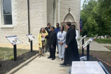 Clergy at Sacred Heart Catholic Church unveil storyboards on Juneteenth honoring the enslaved at White Marsh Plantation in Bowie.