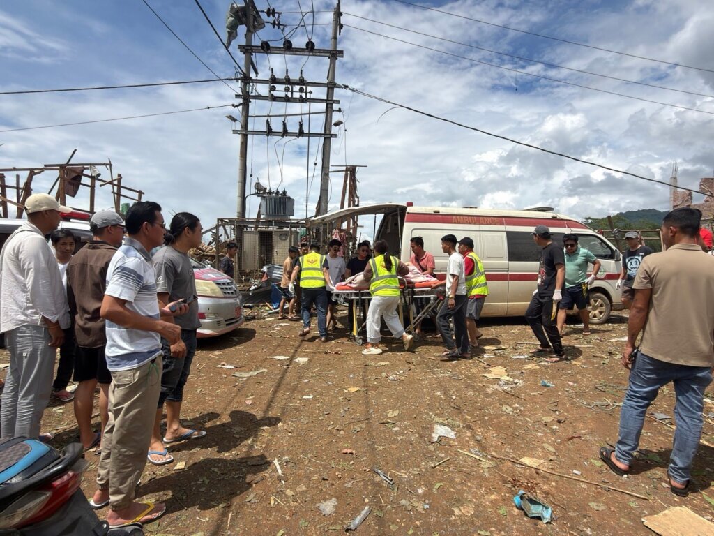Rescuers dig for bodies after a mining explosives blast in Myanmar kills at least 43
