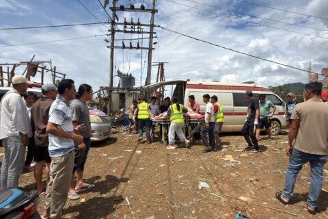 Rescuers dig for bodies after a mining explosives blast in Myanmar kills at least 43