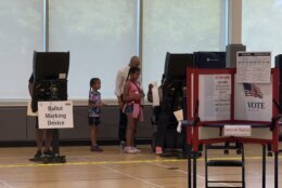 DC polling place with Robert White voting with his daughters
