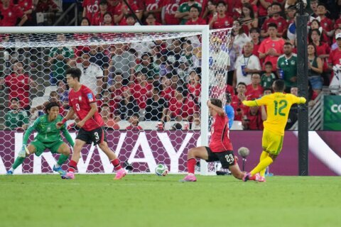South Africa reaches World Cup knockout round for 1st time with 1-0 win over South Korea