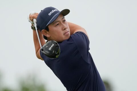 Dylan Wu laughs at himself after five-putting his first hole in the third round at the US Open
