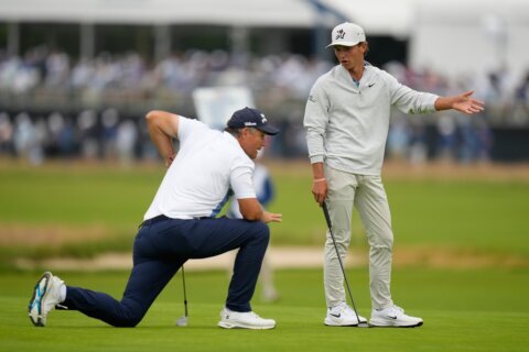 Well done, young man: 17-year-old Russell’s US Open debut impresses 54-year-old partner Harrington