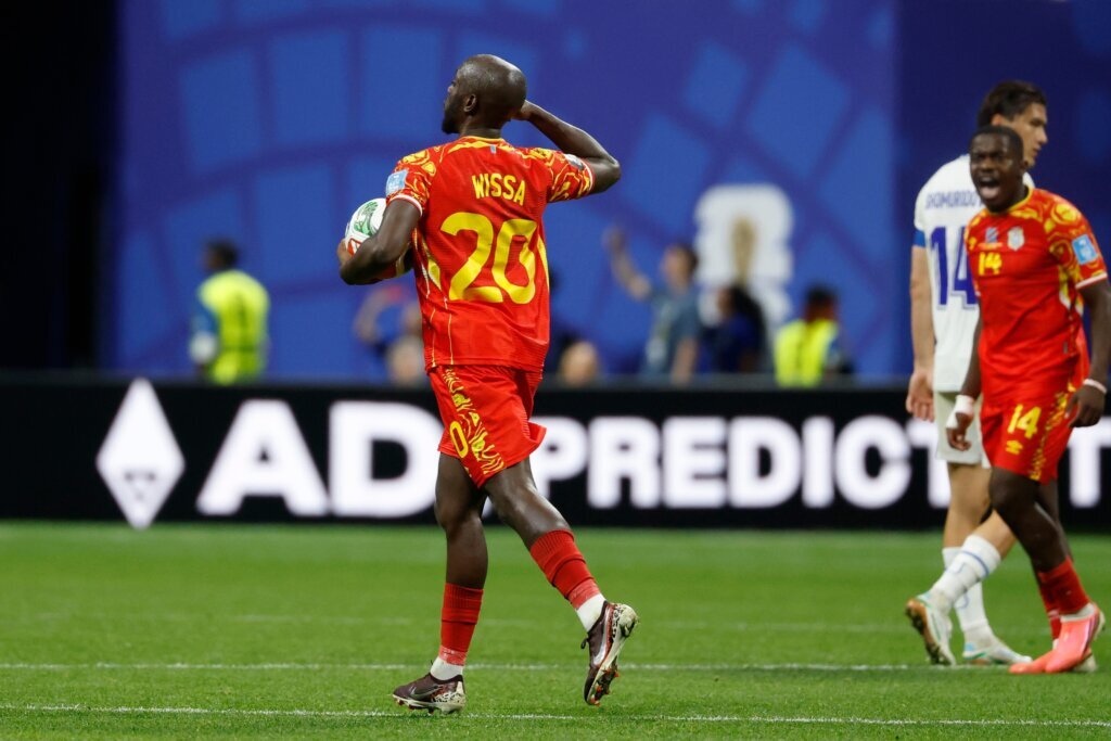 Congo rallies to a 3-1 win against Uzbekistan to seal place in the World Cup knockouts