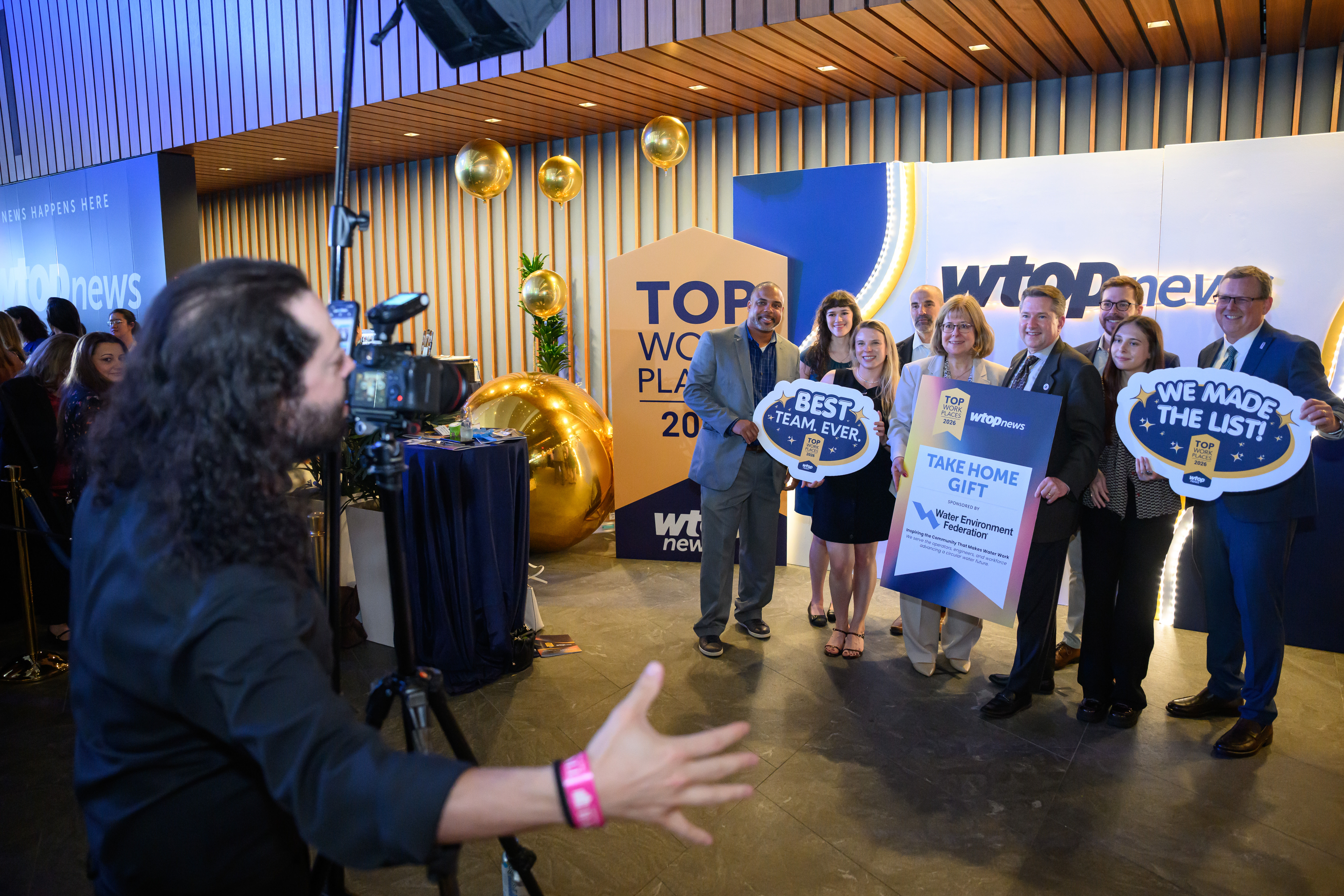 a group of people standing to take a photo