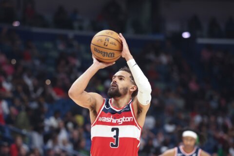 Trae Young agrees to 4-year, $212M extension with Washington Wizards, AP source says