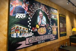 sign inside armands pizzeria