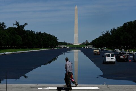 ‘Residual algae’ coats part of newly opened Reflecting Pool