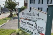 sign welcoming people to the town of haymarket