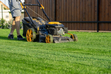 Person mowing grass.