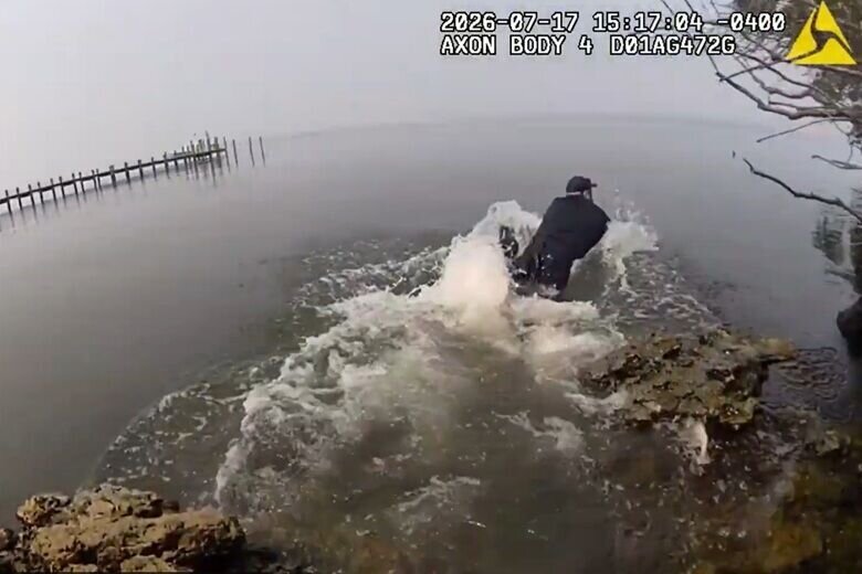 This still from body-worn camera footage shows St. Mary's County Sheriff's Deputy Matthew Camp toward a 9-year-old boy found in a river.