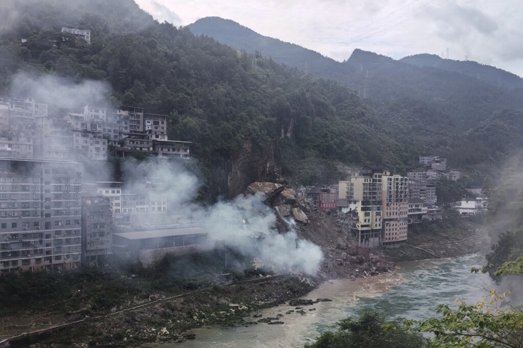 A landslide in southwest China buries homes and forces more than 1,000 to evacuate