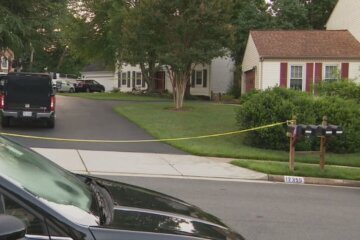 homes in neighborhood with police tape