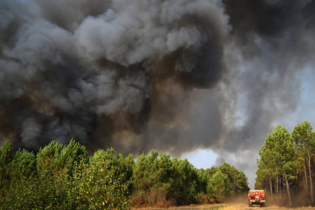 Tens of thousands of French wildfire evacuees allowed to return home as cooler weather moves in