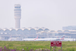 WASHINGTON, DC - JULY 17: Smoke from massive wildfires in Canada and Minnesota engulf the Washington, D.C. skyline, reducing visibility and casting a colored haze over the Ronald Reagan Washington National Airport on July 17, 2026 in Washington, DC. Authorities are continuing to monitor for unsafe conditions as air quality alerts are in effect across a vast portion of the United States. (Photo by Finn Gomez/Getty Images)