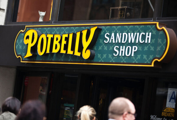 Pedestrians walk outside of a Potbelly Sandwich Shop