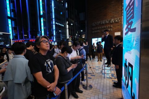 Fans mark the release of new Haruki Murakami novel at a midnight event in Tokyo