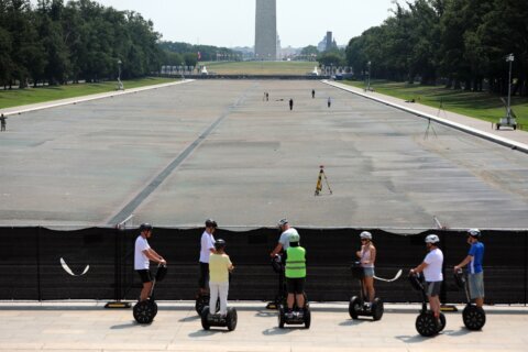 Drained Reflecting Pool reveals Trump’s ‘American flag blue’ liner is now closer to gray