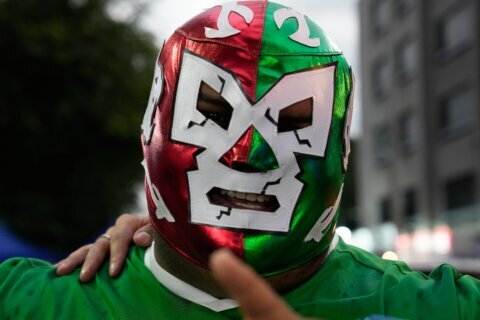 Masked wrestlers flood Mexico’s World Cup streets as fans embrace lucha libre fever