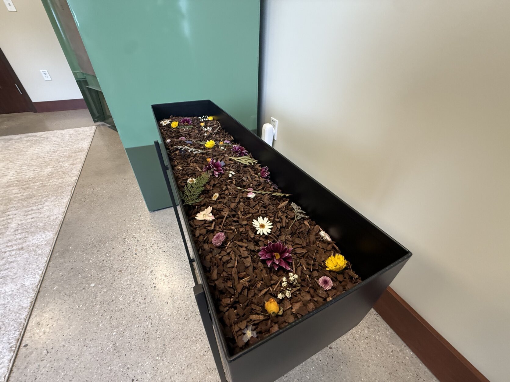 A tray of composted human flesh, outside what's known as a "vessel" in the human-composting space.