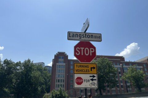 stop sign with street sign on blue sky day