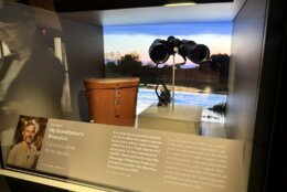 museum display with large binoculars featured