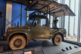 old outdoor utility vehicle on display at museum
