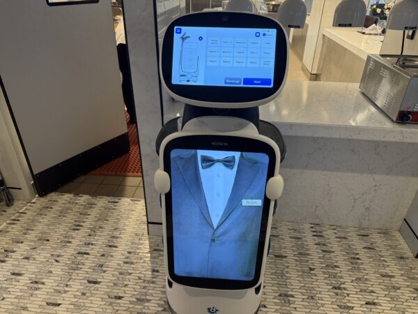 robot with projection of tuxedo on screen