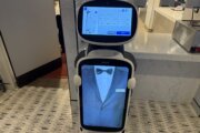 robot with projection of tuxedo on screen