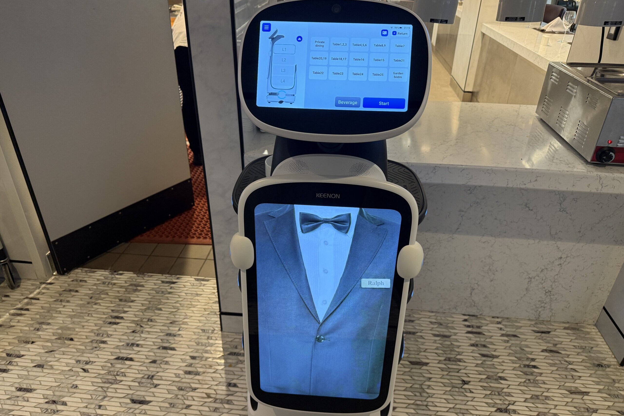 robot with projection of tuxedo on screen