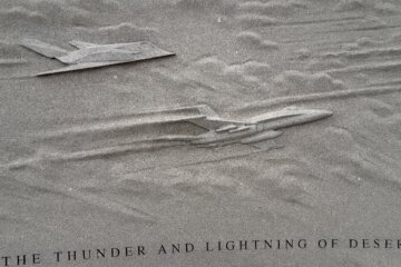 two warplanes carved into gray stone