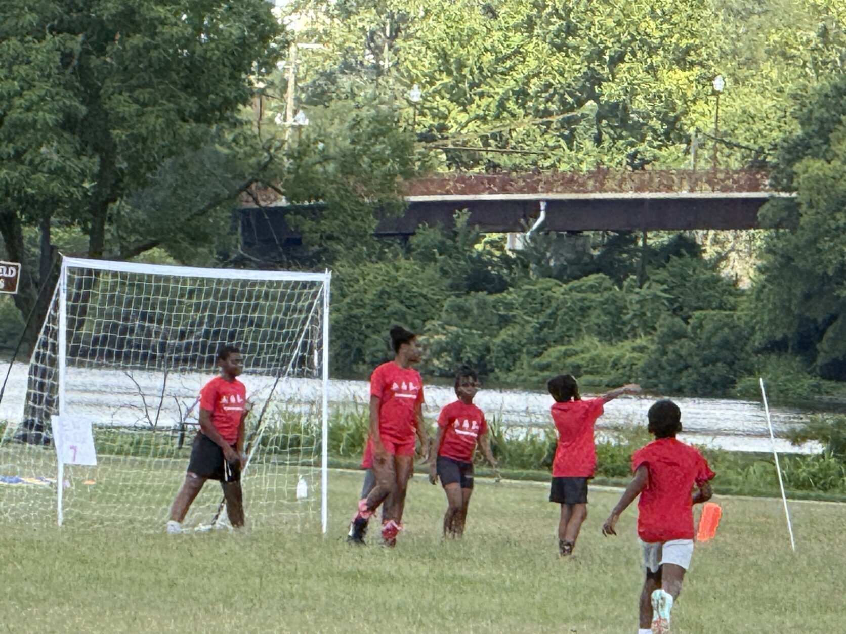 Campers stand in formation at the mouth of the net, penalty kick-style