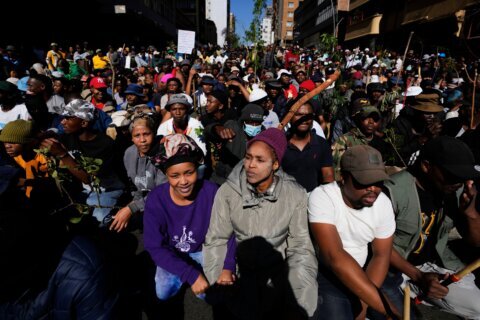 Anti-immigration protesters march in South Africa, as some immigrants leave the country