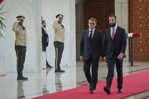 Explosions rock Damascus, wounding 18, as French President Macron visits Syria