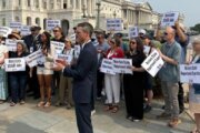 Former federal workers, lawmakers, mark a year after DOGE purge
