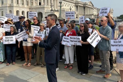 Former federal workers, lawmakers, mark a year after DOGE purge