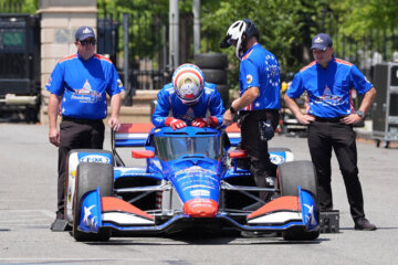 IndyCar Series driver David Malukas boards a race car on West Executive Drive at the White House during a showcase for the upcoming Freedom 250 Grand Prix auto race, Monday, July 13, 2026, in Washington. (AP Photo/Alex Brandon)