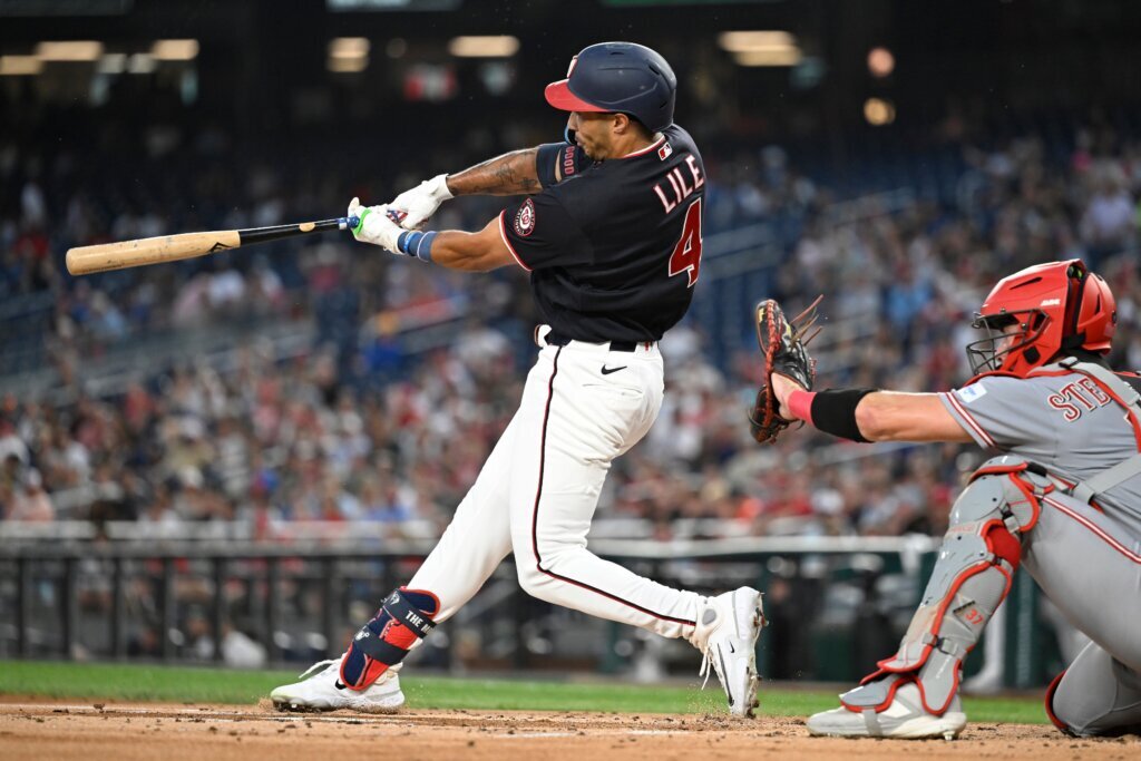 Lile and Ford homer to give the Nationals all their runs in a 5-3 victory over the Reds