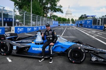 Kyle Kirkwood (27) poses for a photo after winning the IndyCar Freedom 250 Grand Prix auto race in Washington, Sunday, Aug. 23, 2026. 6. (AP Photo/Nick Wass)
