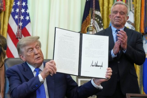 FACT FOCUS:  Trump makes false claims as he signs order urging revisions around childhood vaccines