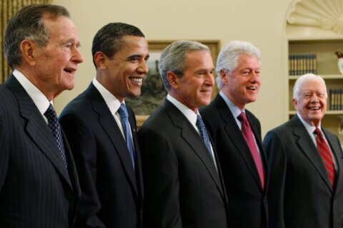 Trump goes unmentioned but not ignored as Clinton, Bush and Obama step up as essayists on presidents