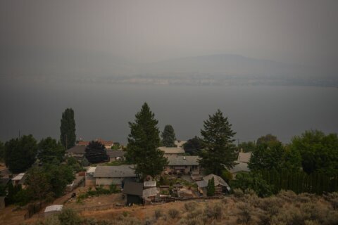 Canada puts the military on standby as British Columbia wildfires kill 1 and displace thousands