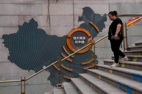 Chinese court sentences founder of troubled property developer Evergrande to life in prison
