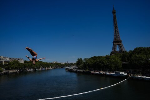 High divers take the plunge in the Seine in a new test of Paris’ reclaimed river