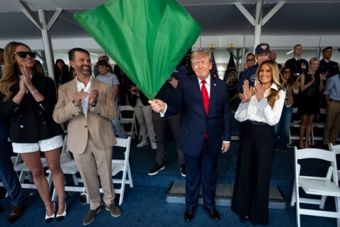 Trump waves the green flag to start the IndyCar race as drivers zoom through Washington’s streets