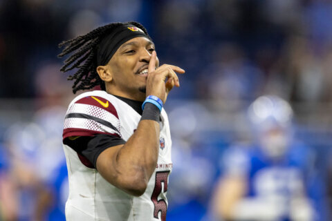DETROIT, MICHIGAN - JANUARY 18: Jayden Daniels #5 of the Washington Commanders celebrates during an NFL Football game against the Detroit Lions at Ford Field on January 18, 2025 in Detroit, Michigan. (Photo by Michael Owens/Getty Images)
