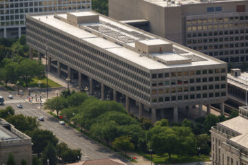 a brutalist building in urban environment pictured from above