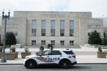 police car sits in front of DC Armory